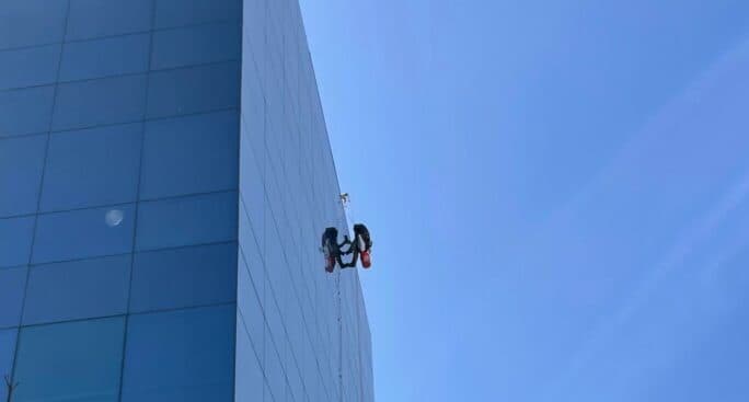 Certified rope-access technician working at height