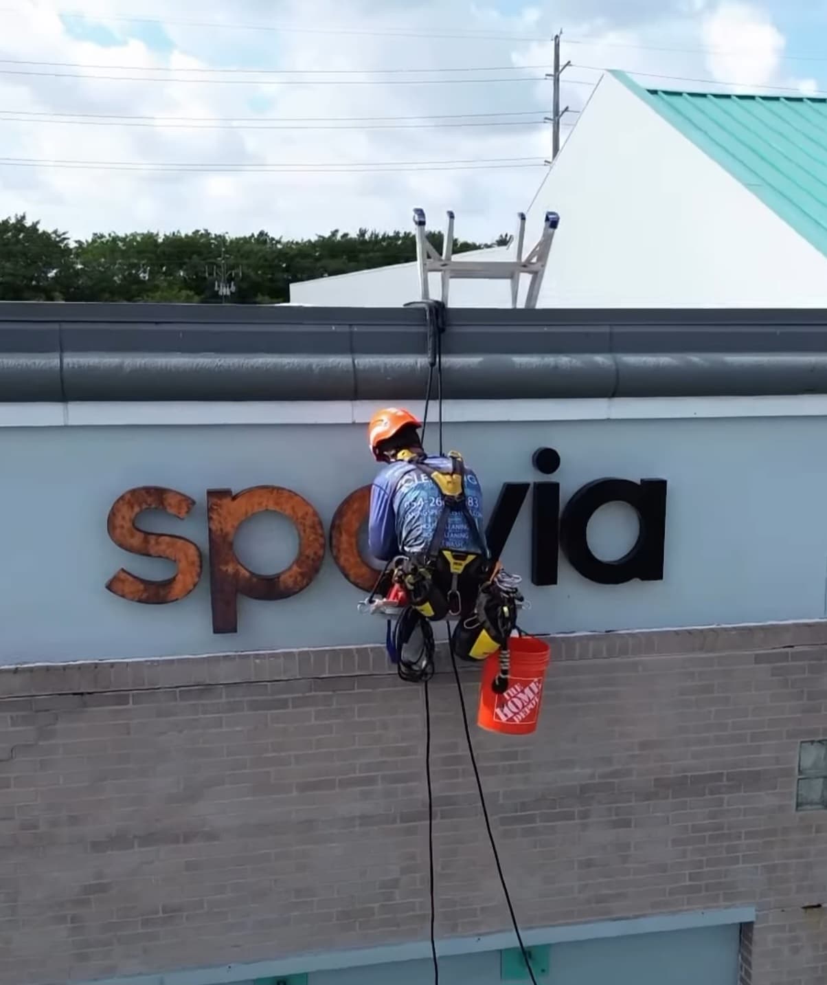Cleaning Specialist rope-access technician working at height